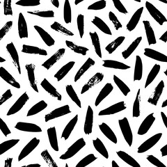 Seamless pattern with irregular black dashes. Simple geometric texture with short brushstrokes. Abstract background in Memphis style. Ink painted hand made texture. Vector black ink ornament.