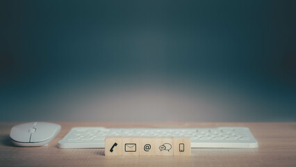 Contact us service support or e-mail marketing concept. Hotline people connect for Website page banner and wooden coins with symbol telephone, email, address. copy space for text.