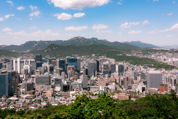 Obraz premium City building skyline and mountain view of downtown Seoul South Korea from Namsan tower