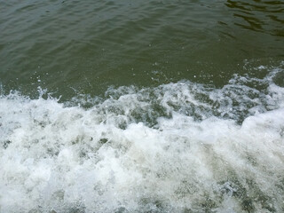 water foam from the movement of ships on the river