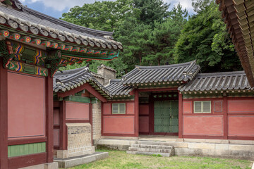 Colorful Korean painted wood building complex architecture at the Changdeokgung palace in Seoul South Korea