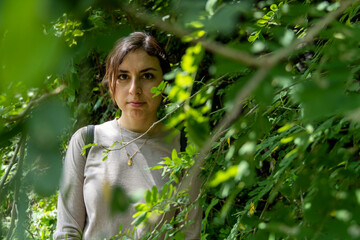 young woman descending in the ravine, vegetation and trees, huentitan ravine guadalajara, mexico