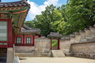 Colorful Korean painted wood building complex architecture at the Changdeokgung palace in Seoul South Korea	