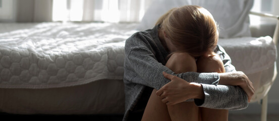 Young caucasian woman is depression and having mental problem in the bedroom at home, emotion and...