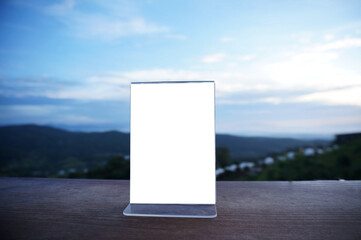 Wenu frame standing on wood table in  Bar restaurant cafe. Space for text marketing promotion.  © Wanda