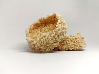 Rengginang traditional Indonesian snack, made from fried dry rice, crispy and crunchy, isolated on white background