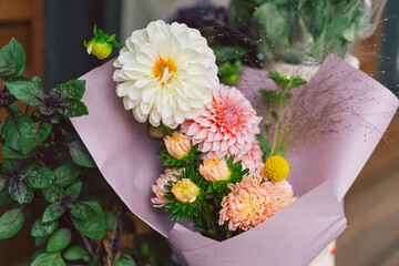 Beautiful flower composition with autumn pink and white floand. Autumn little bouquet.