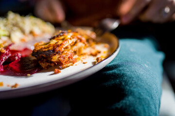 lasagna on a plate in a restaurant 