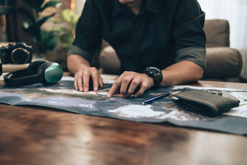 Travelers planning trips and finger pointing on map, or find travel routes. Travel concept.