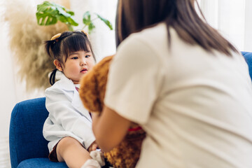 Portrait of enjoy happy love asian family mother and little asian girls child smiling and having fun talk with cute kid daughter moments good time