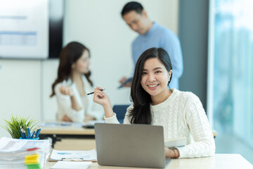 Group of businesspeople having meeting in conference room.