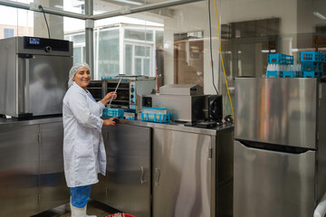 Woman working in a dairy factory