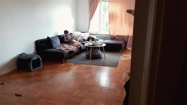 Boy Plays Video Game On Nintendo Switch Using A Controller For Gaming