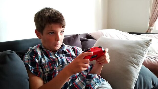 Boy Is Gaming Video Game On Nintendo Switch Gaming Console