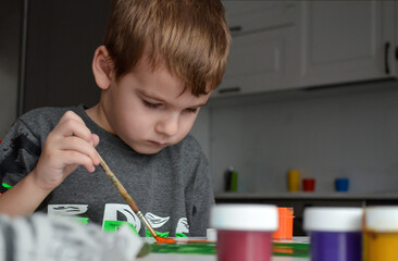 child playing with paints