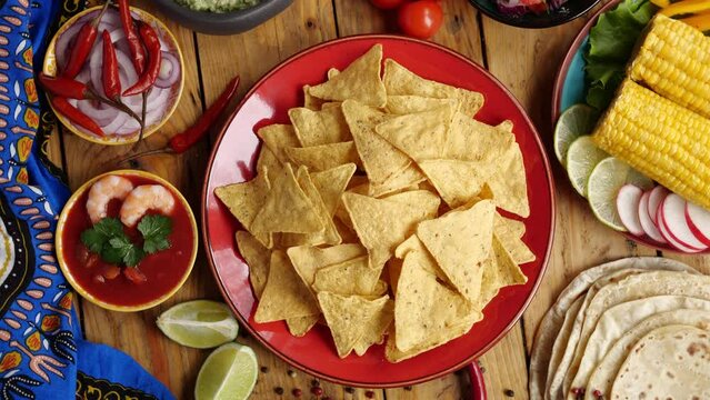 Tortilla chips nachos and guacamole avocado sauce. Traditional mexican appetizer, tex mex food