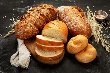 Bread assortment on dark background.