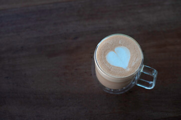 heart coffee on wooden table