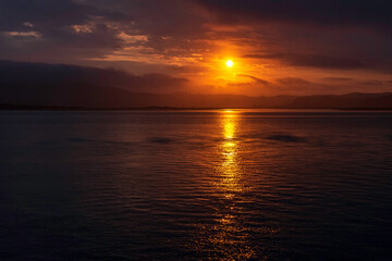 Amazing sunset on the Atlantic Ocean. The sun reflected in the waves