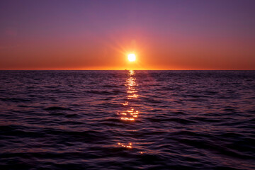 Amazing sunset on the Atlantic Ocean. The sun reflected in the waves