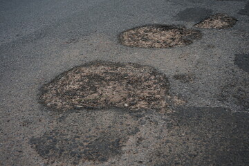 Damaged roads are dangerous for road users.