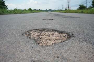 Damaged roads are dangerous for road users.