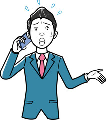 焦って携帯電話をかけるビジネスマン