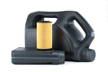 Car oil filter and motor oil can over a white