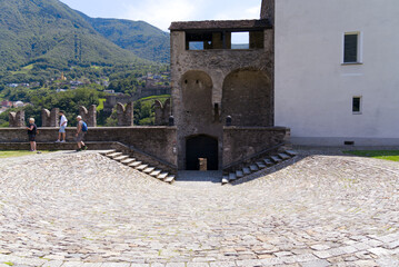 Courtyard of medieval castle Castelgrande at City of Bellinzona on a sunny summer day. Photo taken July 4th, 2022, Bellinzona, Switzerland.