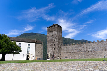 Scenic view of Unesco world heritage castle Castelgrande at City of Bellinzona, Canton Ticino, on a blue cloudy summer day. Photo taken July 4th, 2022, Bellinzona, Switzerland.