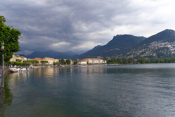 Fototapeta na wymiar Scenic view of bay of Lake Lugano, Canton Ticino, on a cloudy summer day. Photo taken July 4th, 2022, Lugano, Switzerland.