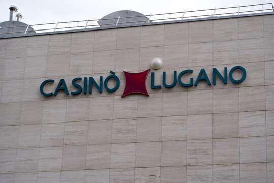 Facade with logo of Lugano Casino on a cloudy and rainy summer day. Photo taken July 4th, 2022, Lugano, Switzerland.