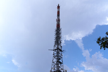 Communications tower at local mountain San Salvatore at City of Lugano on a cloudy summer day. Photo taken July 4th, 2022, Lugano, Switzerland.