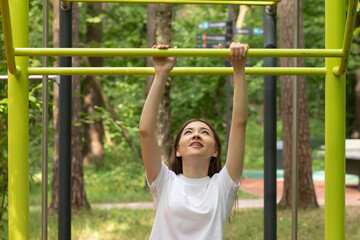 teenager sport at school and college, teen girl doing sports exercises in a street gym