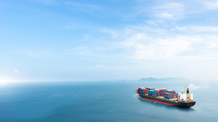 Container cargo ship in the ocean at sunset blue sky background with copy space, Nautical vessel...