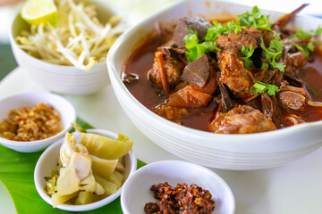 Thai rice noodles with (northern) Lanna curry called nam ngio. Thai food.