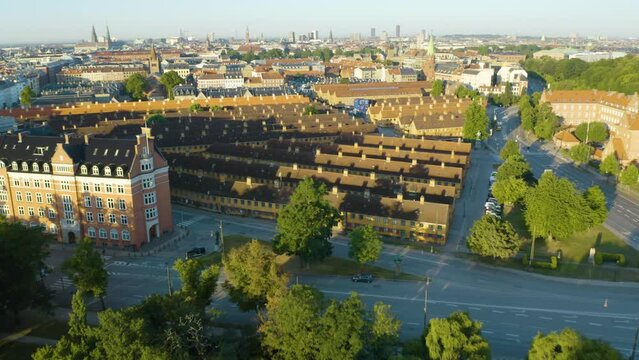 Drone Shot Reveals Nyboder Row Houses. Copenhagen Spire Skyline in Background