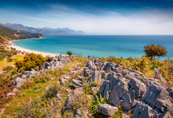 Rocky shore of Lukove beach. Aerial summer seascape of Adriatic sea. Picturesque outdoor scene of Albania, Europe. Beauty of nature concept background.