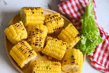corn food , sweet corn cooked on plate background, ripe corn cobs grilled sweetcorn for food vegan dinner or snack