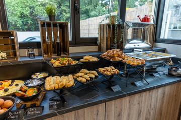 Interior of a hotel restaurant with buffet table