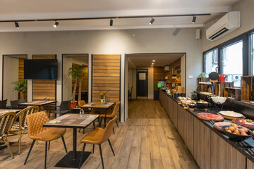 Interior of a hotel restaurant with buffet table