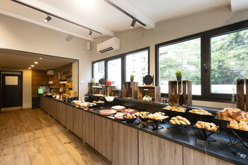 Interior of a hotel restaurant with buffet table