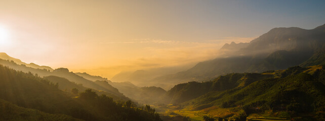 Banner Beautiful landscape mountain green field grass meadow white cloud blue sky on sunny day. panoramic Majestic green scenery big mountain hill cloudscape valley panorama view greenery countryside © aFotostock