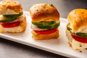 Mumbai style pav sandwich or leftover paav used for veg burger