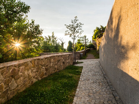 Germany, Bavaria, Nabburg, Cobblestone footpath at sunset
