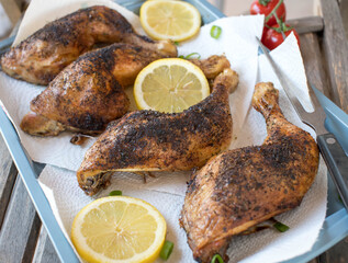Crispy chicken legs on a tray