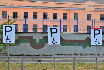 Parking spaces for the disabled are marked on a summer day