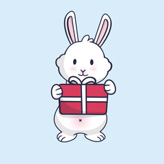 Happy rabbit, symbol of 2023 new year. Christmas bunny. Fluffy bunny with new year present.	
