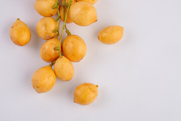 Naklejka na ściany i meble Thai fruit. Fresh ripe mafai with sweet and sour on white
