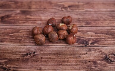 Hazelnut. Nuts on wooden background.